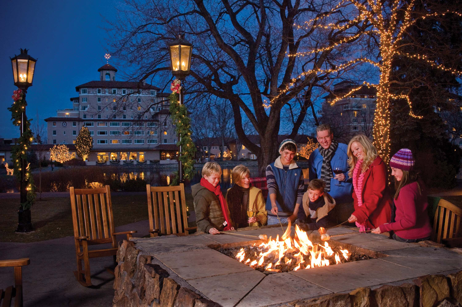 A Family Enjoying Fire in an Outdoor Gas Line-Installed Fireplace 