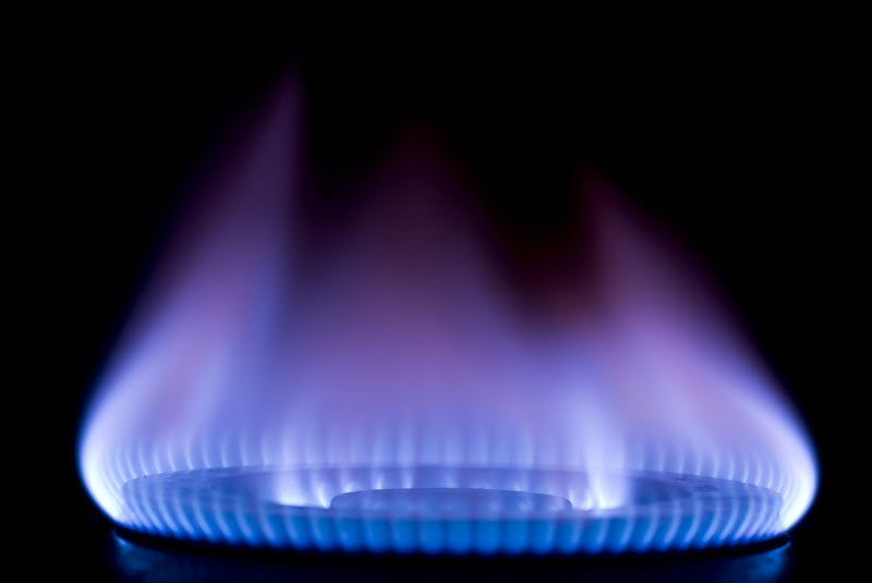 A Gas Stove with a Blue Flame Burning